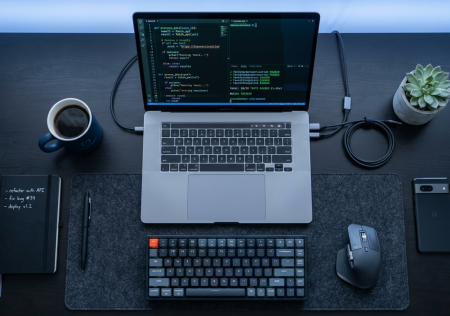 Developer workspace for AI-assisted product development with multiple screens showing code
